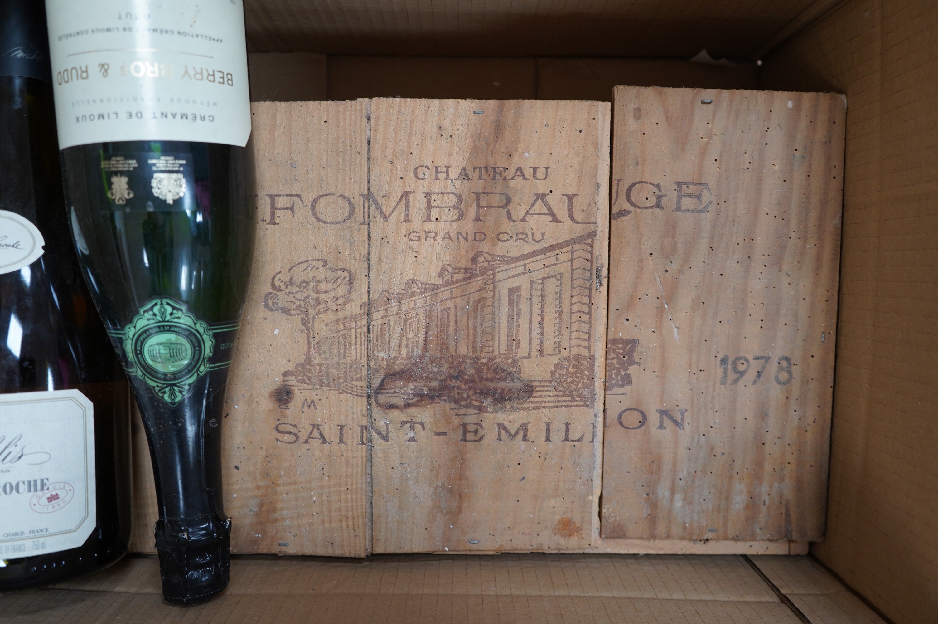 Two large bottles of Chateau Fombrange in wooden crate and three other bottles. Condition - fair, storage unknown